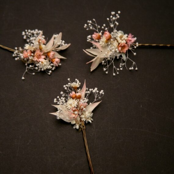 wedding hair pins of dried babies breath and dried straw flowers in pink and ivory