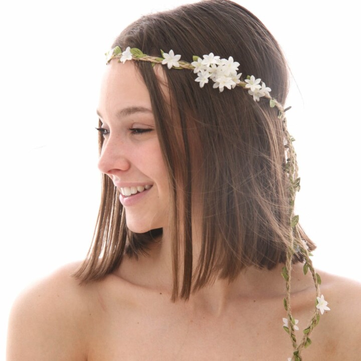 boho wedding flower crown of white flowers and braided twine and green leaves